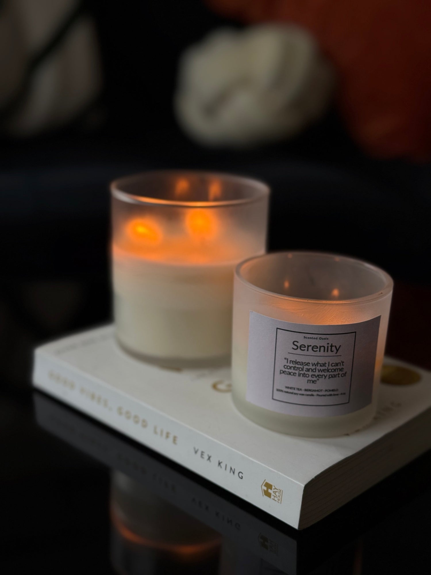 Two candles on a book with a blurred background